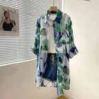 Amazon mid-length loose chiffon blouse with green and blue color blocking abstract print, lightweight and breathable, 2026 European and American cross-border style.