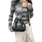 Retro niche trend rivet hand-held bowling bag female 2025 spring new high-end hot girl messenger bag