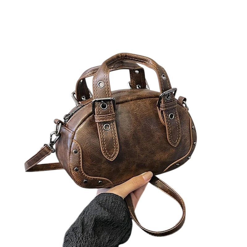 Retro niche trend rivet hand-held bowling bag female 2025 spring new high-end hot girl messenger bag