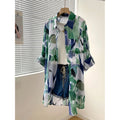 Amazon mid-length loose chiffon blouse with green and blue color blocking abstract print, lightweight and breathable, 2026 European and American cross-border style.