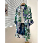 Amazon mid-length loose chiffon blouse with green and blue color blocking abstract print, lightweight and breathable, 2026 European and American cross-border style.