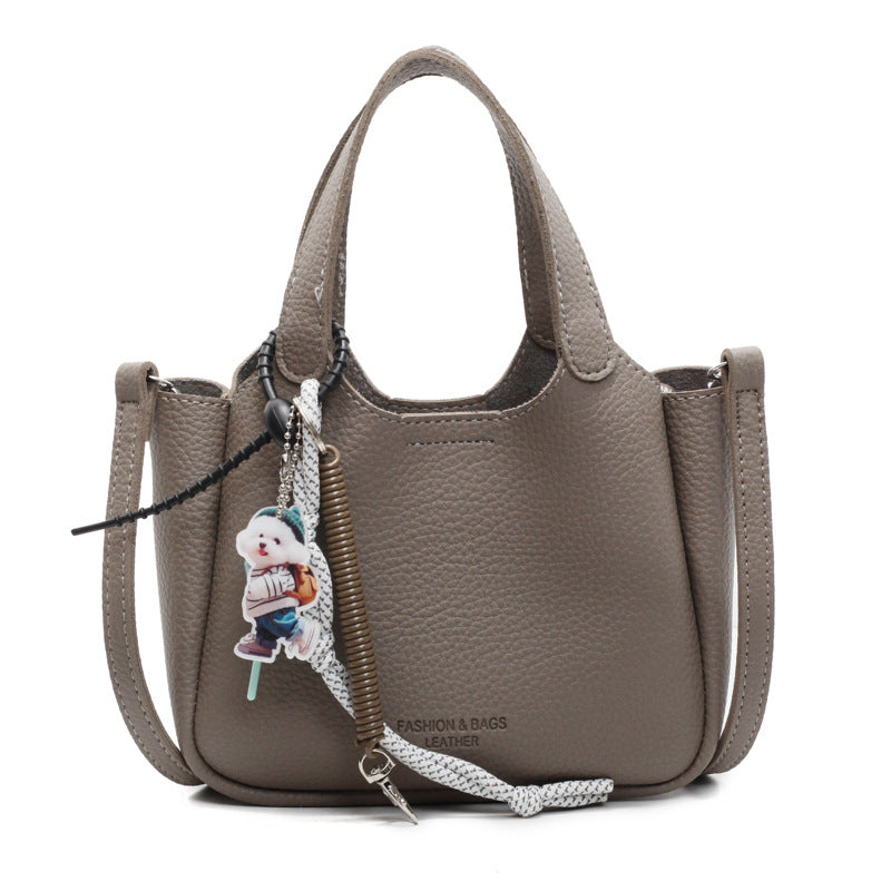 Cross-border hand-held bucket bag for women, high-end 2025 new versatile simple shoulder messenger bag niche vegetable basket bag